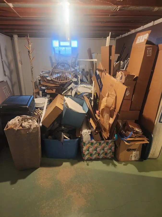 Roll-off dumpster container at job site for 2 Yard Dumpster Rental in Monticello